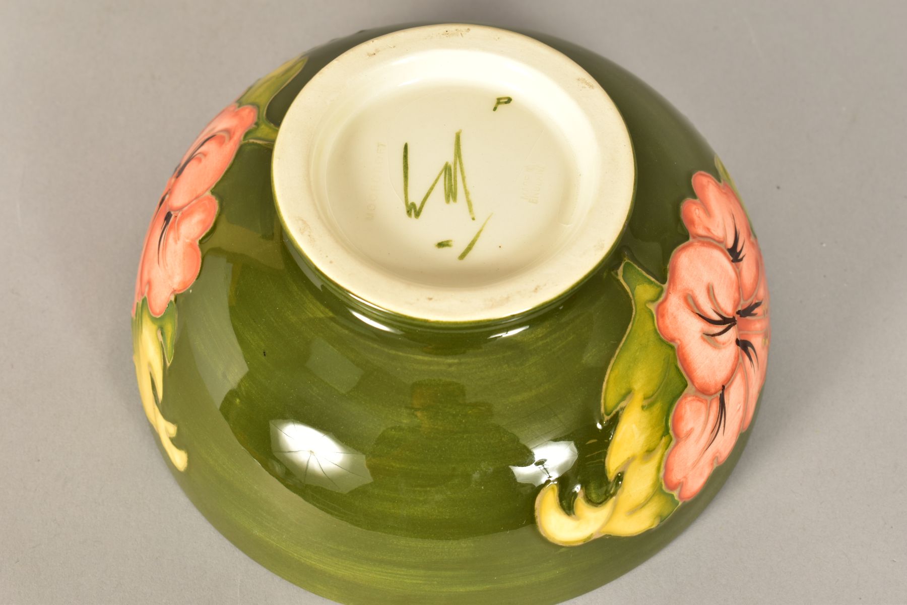 A MOORCROFT POTTERY FOOTED BOWL, 'Hibiscus' pattern on green ground, impressed backstamp and painted - Image 7 of 8