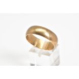 A 9CT GOLD WIDE WEDDING BAND, the plain polished band, with a 9ct hallmark for London, ring size