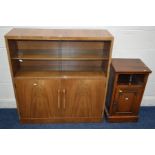 A 1930'S WALNUT GLAZED BOOKCASE, above double cupboard doors with Lee Longlands label, width 99cm, x