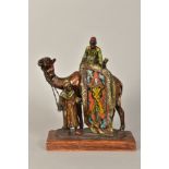 A COLD PAINTED SPELTER FIGURAL TABLE LIGHTER OF A CAMEL AND TWO MEN, in the Bergmann style,