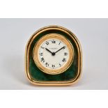 A CARTIER TRAVEL CLOCK, set with a green enamel panel around white dial with Roman numerals