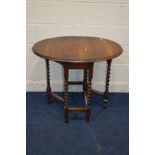 AN EARLY TO MID 20TH CENTURY OAK OVAL TOPPED BARLEY TWIST GATE LEG TABLE, open width 86cm x closed