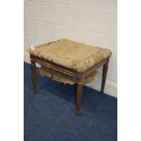 A DISTRESSED LATE 19TH CENTURY OAK RECTANGULAR STOOL, with needlework upholstery, width 60cm x depth