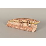 BLANDINE ANDERSON, a stoneware sculpture of an alligator on a rock, brown colouring, impressed mark,