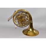 A JOSEF LIDL FRENCH HORN with some dents and missing varnish