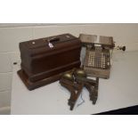 A VINTAGE BURROUGHS ADDING MACHINE, together with a cased Jones sewing machine and a pair of oak and