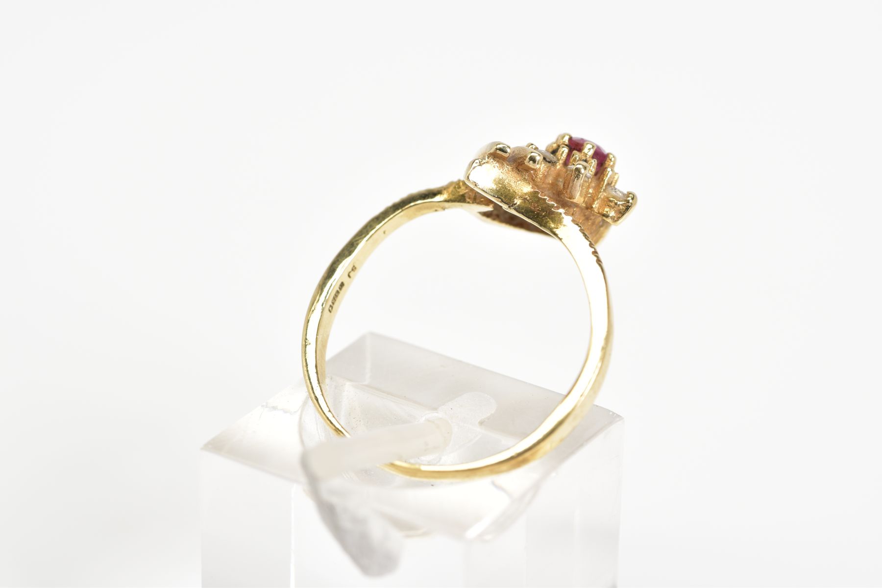 A 9CT GOLD CLUSTER RING, designed as a flower with a central circular cut ruby and brilliant cut - Image 3 of 3