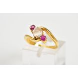 A MODERN RUBY AND MOONSTONE THREE STONE CROSS OVER DRESS RING, ring size J, approximate gross weight