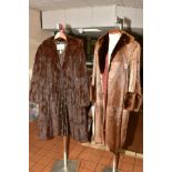 THREE LADIES FUR COATS, comprising a beige cow hide and fur trimmed coat, measures neck to hem 110cm