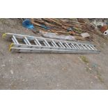AN ALUMINIUM EXTENSION LADDER, with thirteen rungs to each section and 338cm long for each section