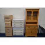 A MODERN GLAZED TWO DOOR BOOKCASE, with two drawers, together with two modern chest of three drawers