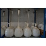 A SET OF EIGHT OPAQUE WHITE OVOID GLASS AND OVER PAINTED NICKEL PLATED CEILING LIGHT FITTINGS,