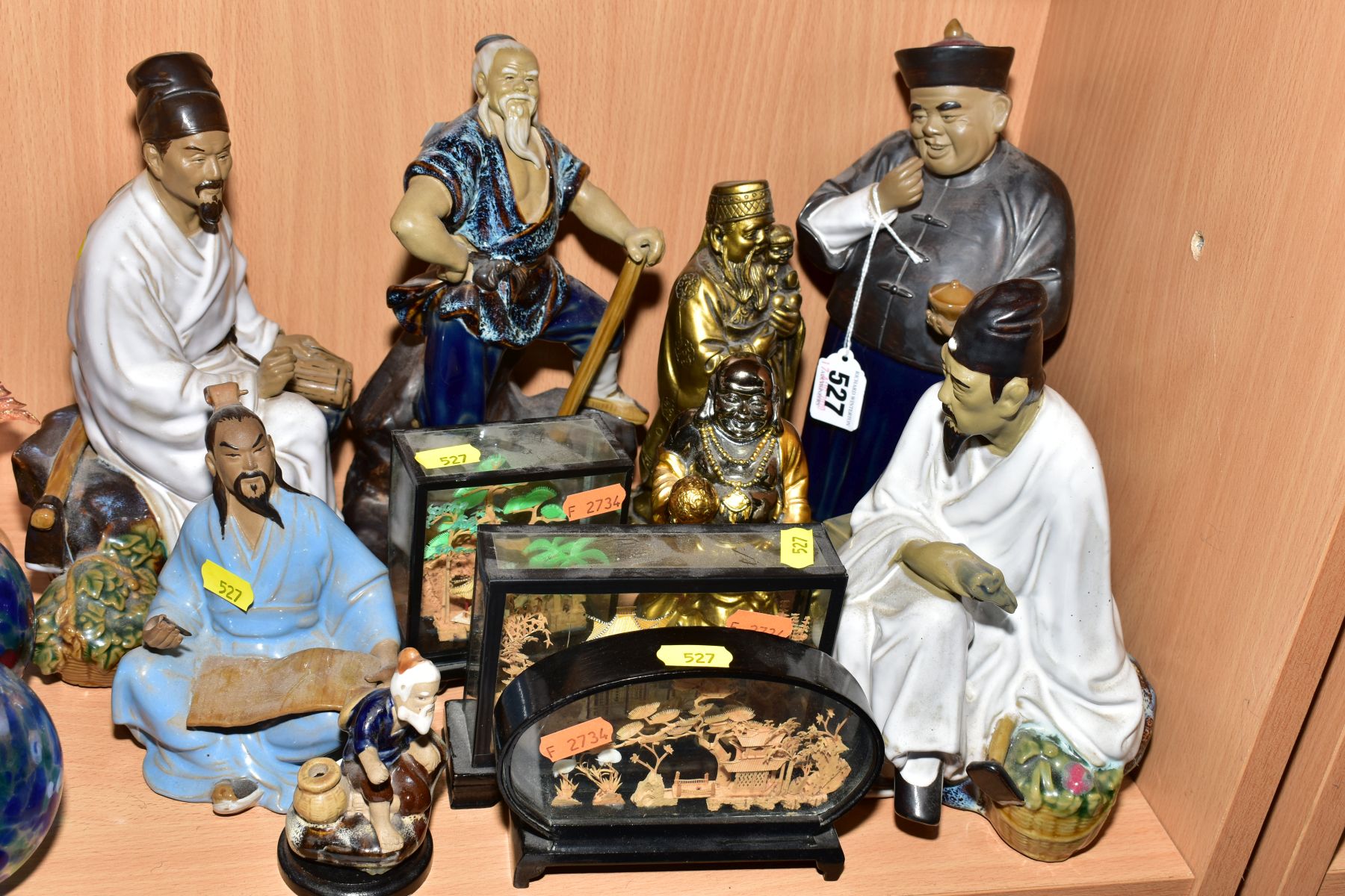 A GROUP OF JAPANESE CERAMIC FIGURES, including two seated scholars, a seated scribe, man with axe,