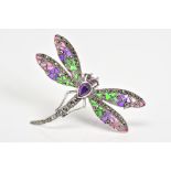 A PLIQUE A JOUR BROOCH, in the form of a dragonfly with pink, purple and green enamel wings, an
