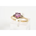 A 9CT GOLD HEART SHAPED RING, designed with heart shaped ruby with heart shape shoulders each set