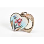 AN ENAMEL LOCKET, of white metal in the shape of a heart with enamel detail of a bee and flower to