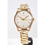 A 9CT GOLD LONGINES WRISTWATCH, a gentlemens wristwatch with a cream dial, Arabic and baton