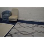 A MODERN BEIGE UPHOLSTERED CHAIR on brass casters and a tub chair together with a woolmark ground