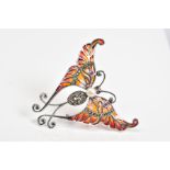 A PLIQUE A JOUR BROOCH, in the form of a butterfly set with orange and red enamel wings, a marcasite