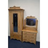 AN EARLY TO MID 20TH CENTURY SATINWOOD SINGLE MIRRORED DOOR WARDROBE with a decorated cornice and