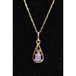 AN OPAL PENDANT NECKLACE, the yellow metal openwork pendant set with an oval cut doublet,