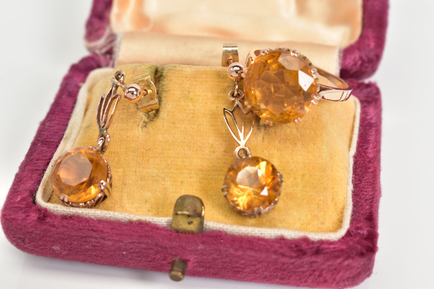 A PAIR OF DROP EARRINGS AND A RING, each drop earring set with a circular cut citrine interspaced