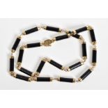 AN ONYX NECKLACE, designed with twenty onyx barrel links, each link approximately 15mm,