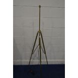 A BRASS TELESCOPIC TRIPOD STANDARD LAMP