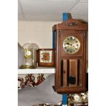 A BRASS SKELETON CLOCK UNDER A GLASS DOME, having enamelled dial with Arabic numerals, with an Art