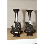 A PAIR OF ORIENTAL BULBOUS MELON SHAPED BRONZE NARROW NECKED VASES, both decorated with two