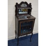 AN EDWARDIAN MAHOGANY SINGLE DOOR CABINET, with a mirrored top and shelf, on cabriole legs, width