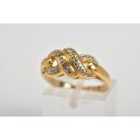 A 9CT GOLD DIAMOND RING, designed as a double infinity knot set with round brilliant cut diamonds,
