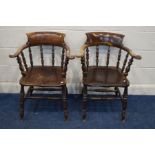 A PAIR OF EARLY 20TH CENTURY STAINED OAK SMOKERS CHAIRS with a turned back