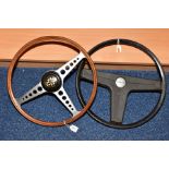 AN E-TYPE JAGUAR STEERING WHEEL, wooden rim with aluminium spokes and extension sleeve (sleeve