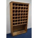 A LARGE EARLY 20TH CENTURY PINE ENGINEERS/PIGEON HOLE CABIINET, comprising of forty two shelves