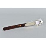 A SILVER AND TORTOISESHELL MAGNIFYING GLASS AND LETTER OPENER, the tortoiseshell worked into a