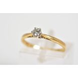 AN 18CT GOLD SINGLE STONE DIAMOND RING, set with a round brilliant cut diamond within a six claw