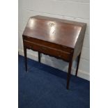 A GEORGIAN OAK FALL FRONT BUREAU with a fitted interior and a single long drawer on square