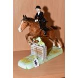 A BESWICK HUNTSWOMAN No982 (head reglued on woman and horse's ear reglued)