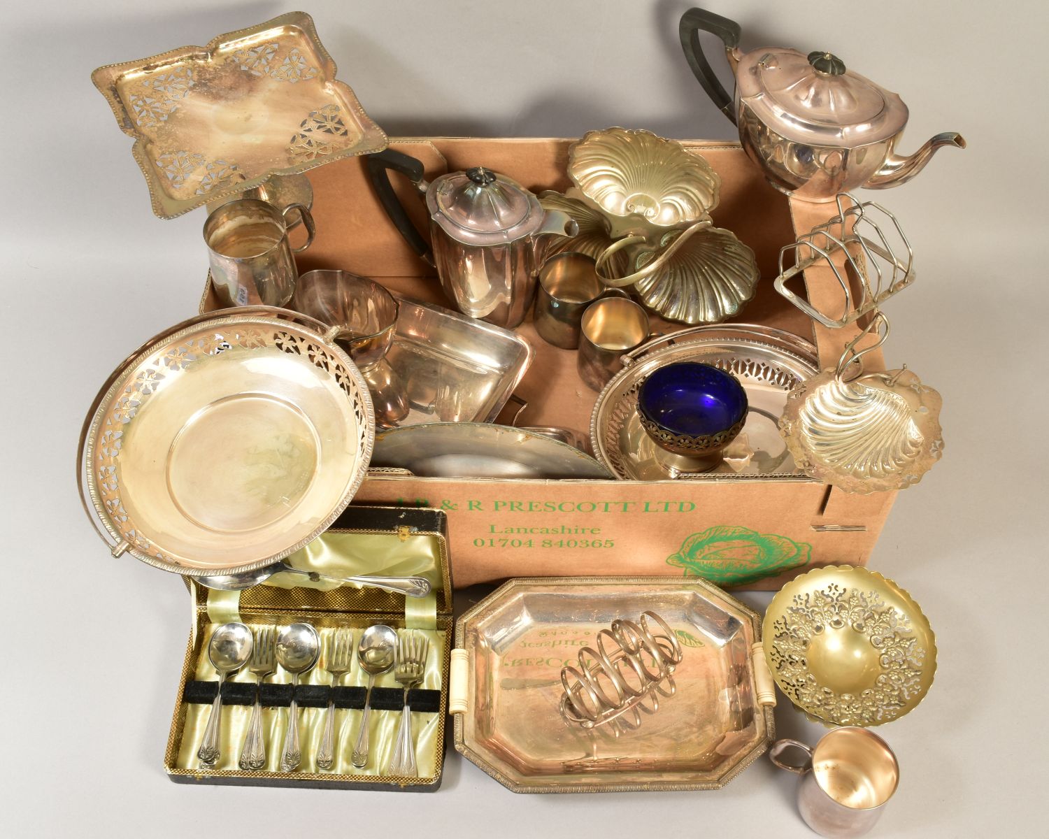 A BOX OF SILVER PLATE, including swing handled cake baskets, hors d'ouvres dish, entree dishes,