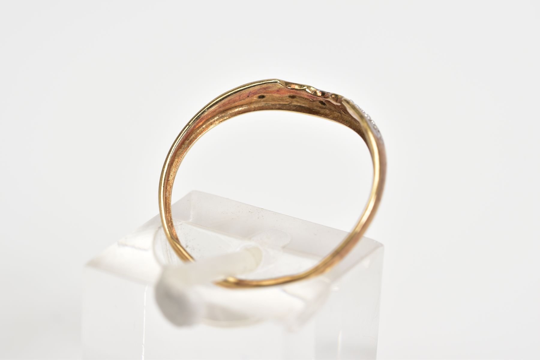 A 9CT GOLD DIAMOND RING, of V shape design, set with a row of single cut diamonds, to the plain - Image 3 of 3