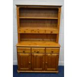 A MODERN PINE DRESSER, with six assorted drawers, width 117cm x depth 43cm x height 184cm (knob in