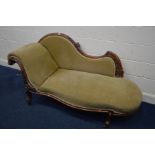 A VICTORIAN MAHOGANY GREEN UPHOLSTERED CHAISE LONGUE with floral carving to frame and scrolled end