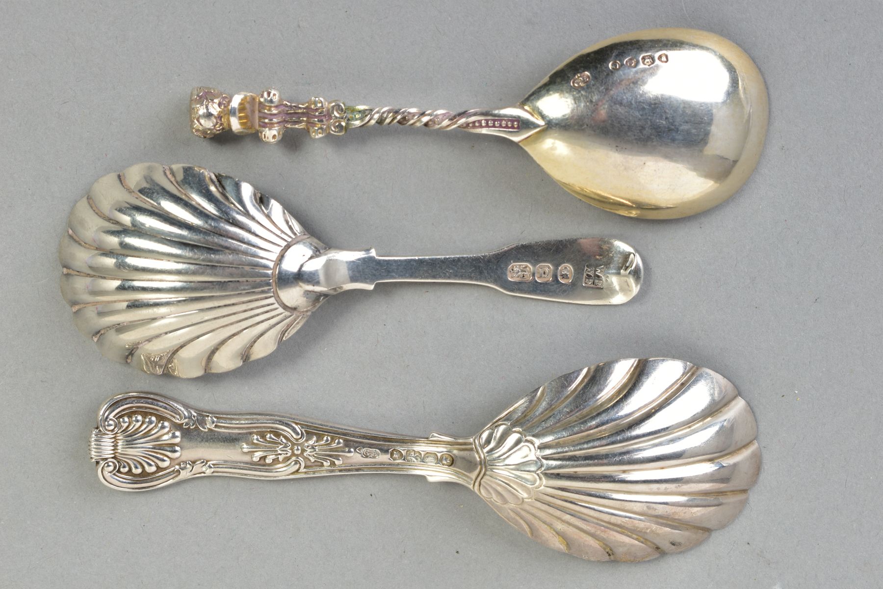 THREE SILVER CADDY SPOONS, to include a Victorian spoon with a cherub to the end of the handle and a - Image 2 of 3