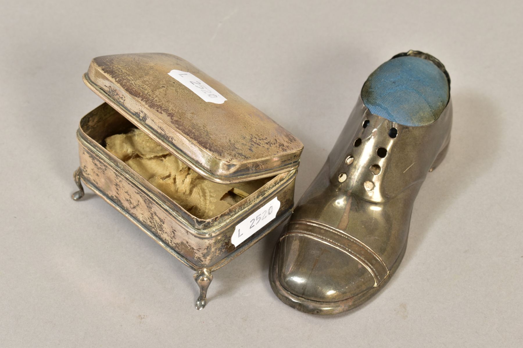 AN EDWARDIAN SILVER PIN CUSHION IN THE FORM OF A GENT'S SHOE, oak sole, registered 548913, makers