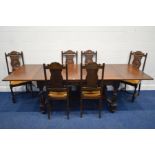 AN EARLY TO MID 20TH CENTURY OAK DRAW LEAF REFECTORY TABLE, parquetry top, on four carved upright