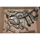 A BOX OF SILVER PLATED/WHITE METAL WALKING STICK HANDLES, two pairs of ornate spurs, dagger parts,