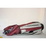 A GOLF BAG containing eleven Rawlings clubs