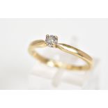 A 9CT GOLD SINGLE STONE DIAMOND RING, set with a round brilliant cut diamond within an illusion
