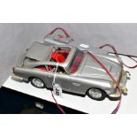 AN UNBOXED BATTERY OPERATED TINPLATE ASTON MARTIN SPECIAL EJECTOR CAR, No.M101, not tested,